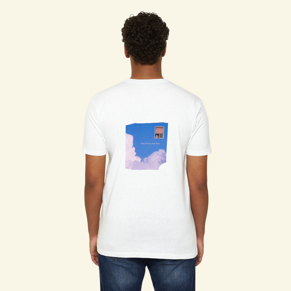 Back view of a PURETE white cotton t-shirt featuring a dreamy cloud and window graphic print on a male model.