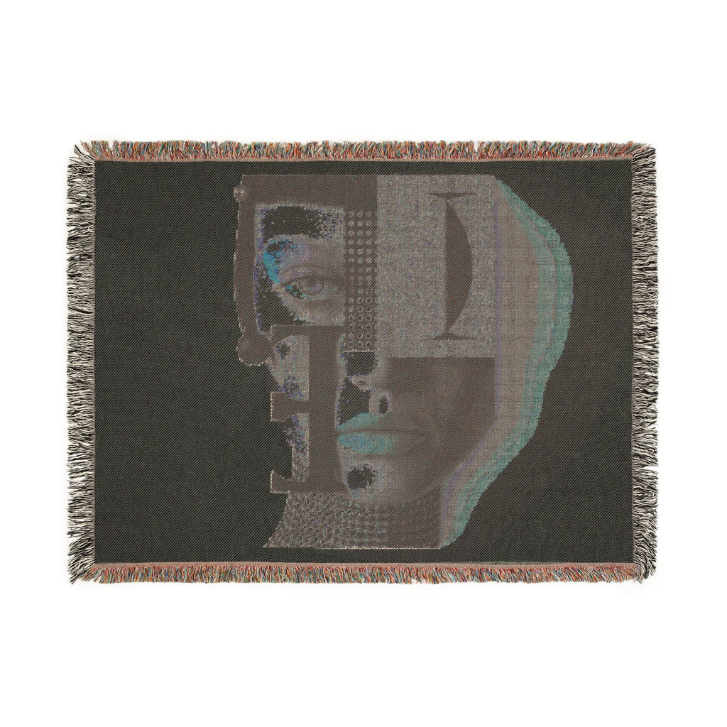 PURETE woven cotton throw blanket featuring a dark abstract portrait design with geometric shapes and fringed edges.