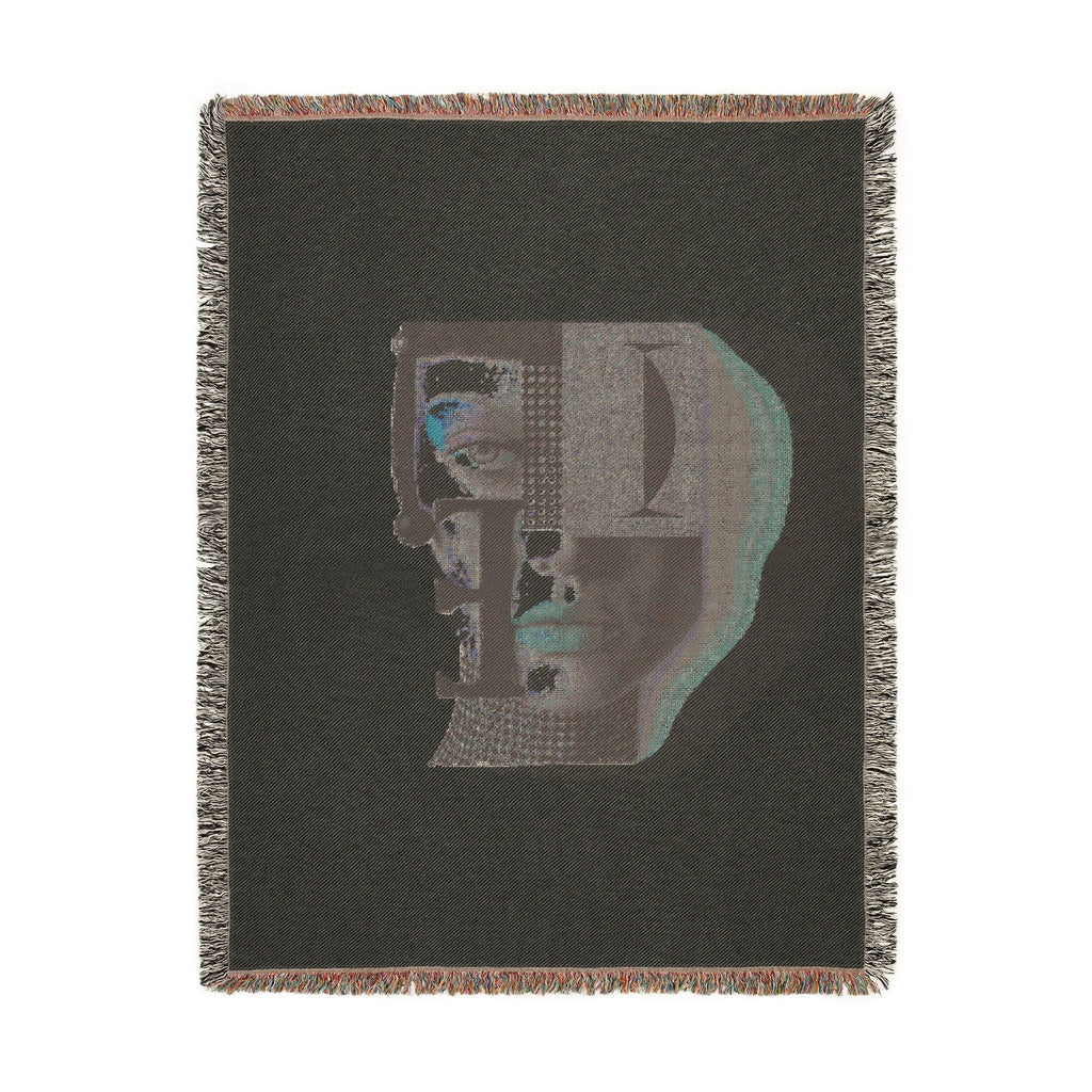 PURETE woven cotton throw blanket featuring a dark grey abstract portrait design with vibrant blue and geometric accents