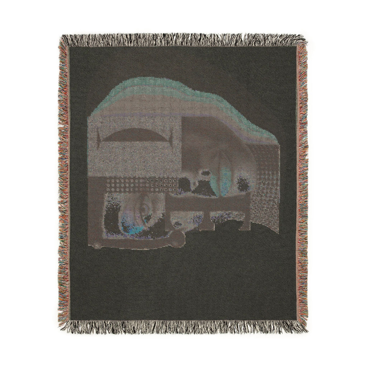 PURETE woven cotton throw blanket featuring a dark abstract portrait design with geometric shapes and fringed edges.