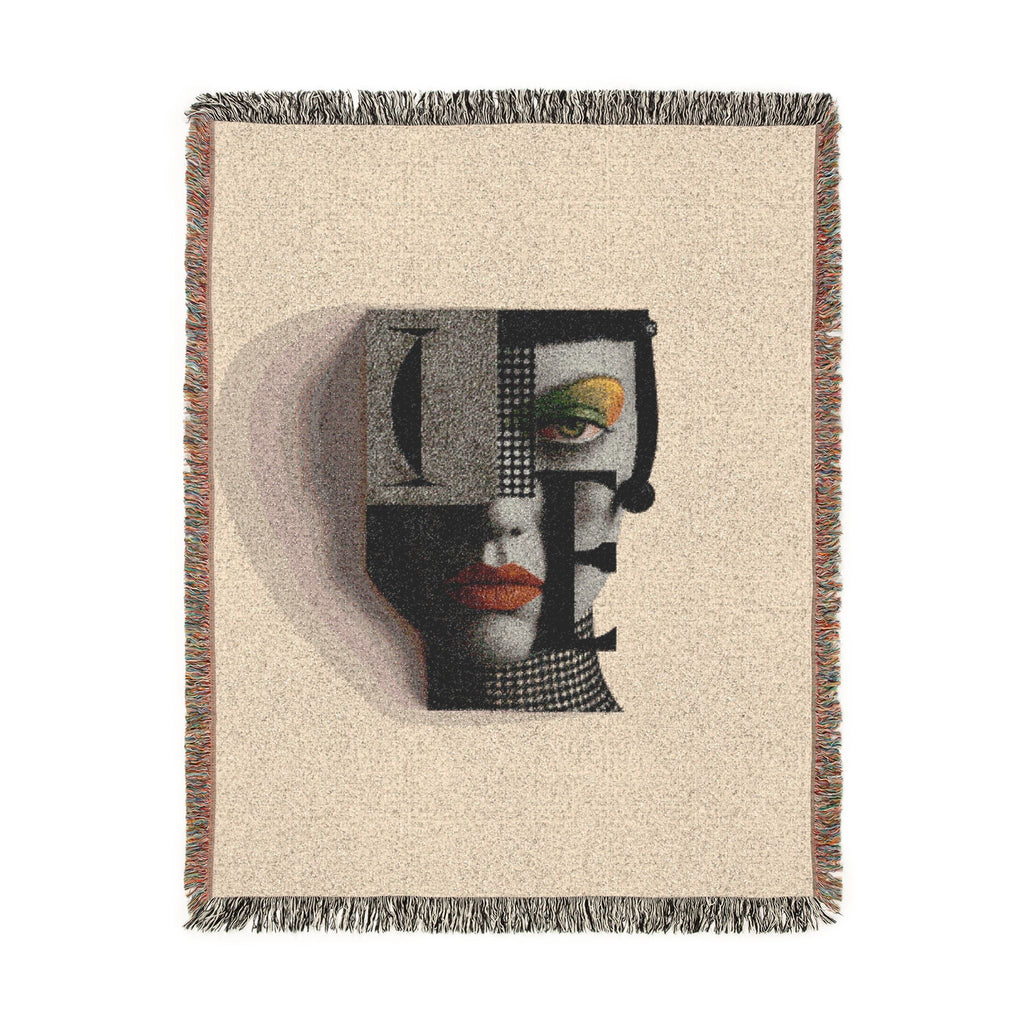 PURETE woven cotton throw blanket featuring a modern abstract portrait design with vibrant accents and fringed edges.