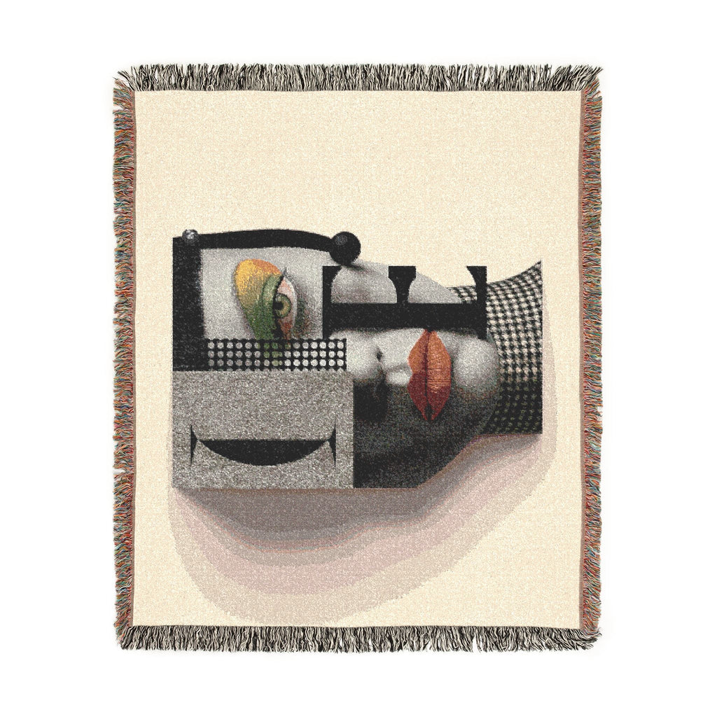 PURETE woven cotton throw blanket featuring a modern abstract portrait design with geometric shapes and fringed edges.