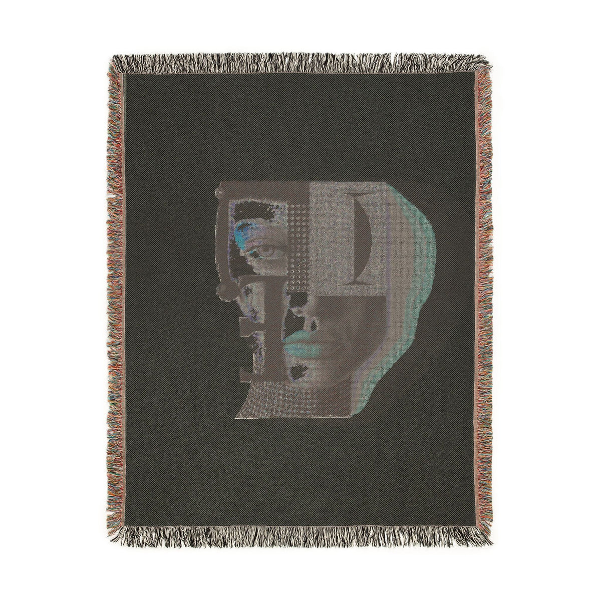 PURETE woven cotton throw blanket featuring a dark grey abstract portrait design with vibrant accents and fringed edges