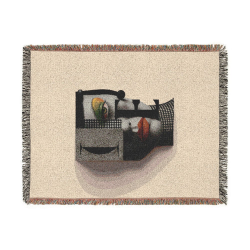 PURETE woven cotton throw blanket featuring a modern abstract portrait design with fringed edges on a cream background