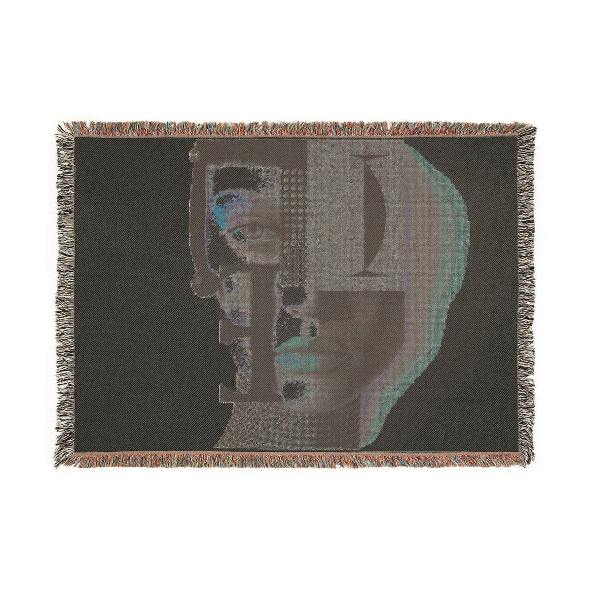 PURETE woven cotton throw blanket featuring a dark abstract portrait design with geometric shapes and fringed edges.