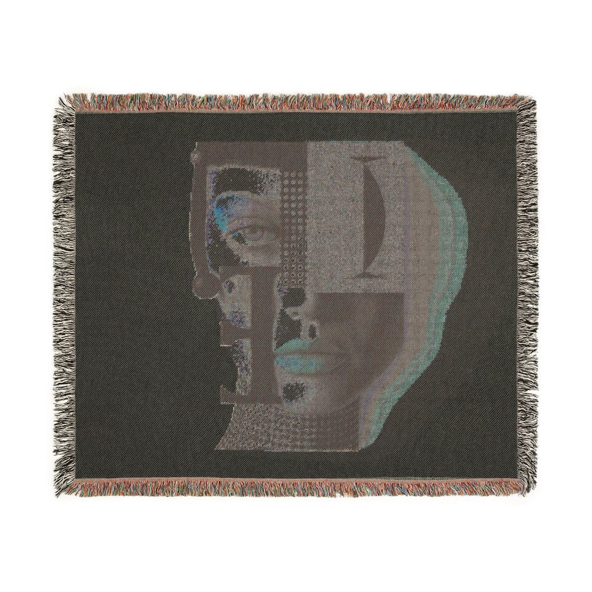 PURETE woven cotton throw blanket featuring a dark abstract portrait design with geometric details and fringed edges.