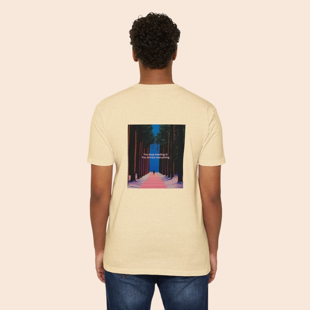 Back view of a PURETE beige cotton blend t-shirt featuring a graphic of a forest pathway and motivational text.