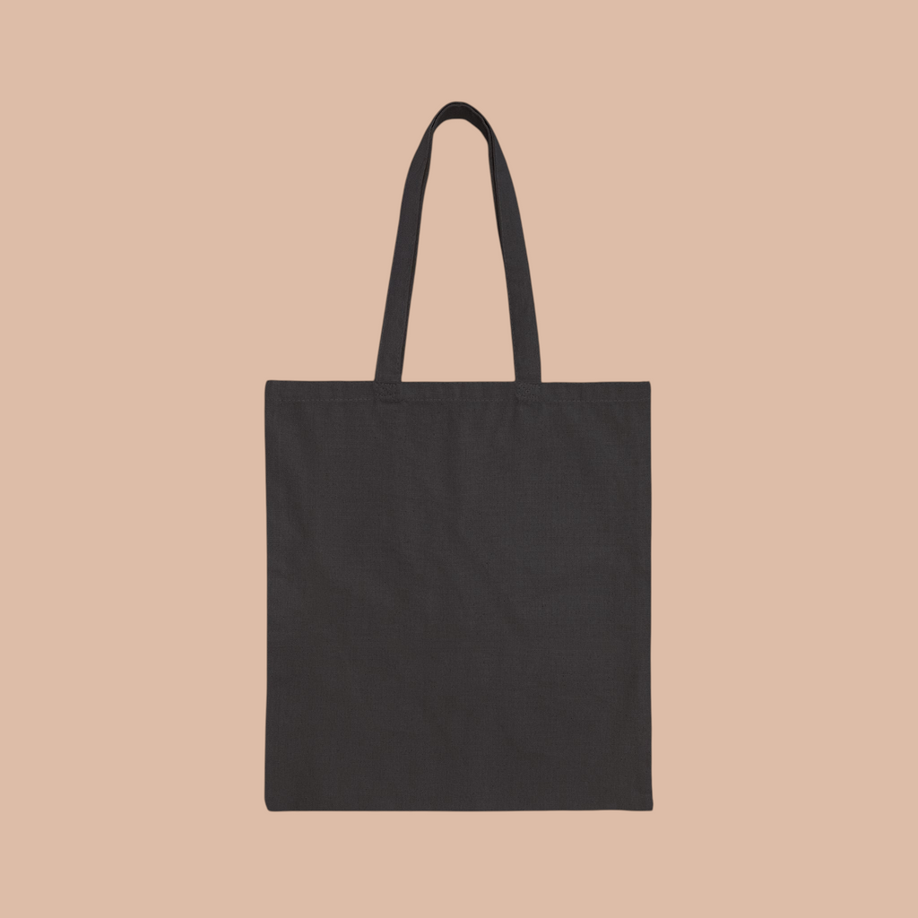 PURETE black cotton canvas tote bag with durable handles for everyday shopping and carrying essentials.