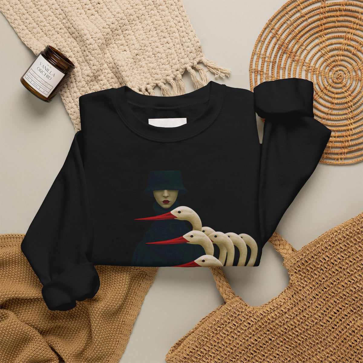 PURETE black crewneck sweatshirt featuring a surreal graphic of a cloaked figure with multiple white bird heads