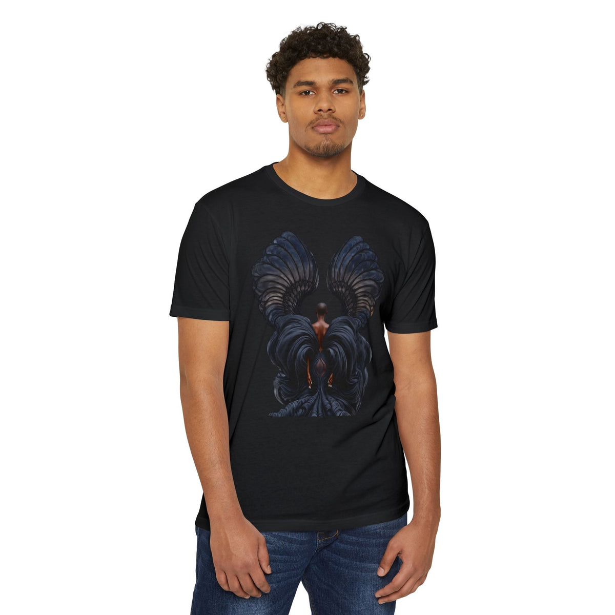 A man wearing a PURETE black CVC jersey t-shirt featuring a graphic print of a figure with large dark wings.