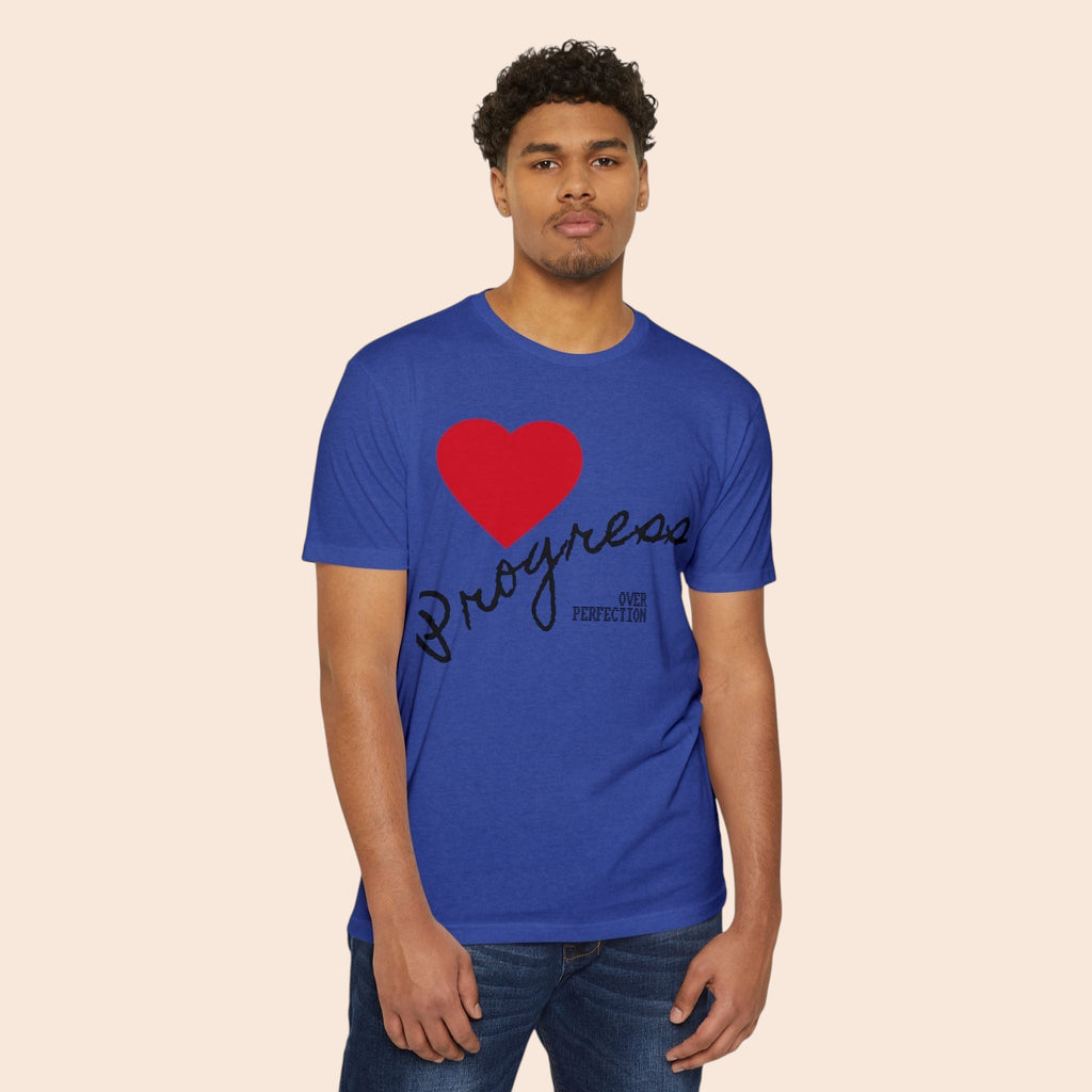 A man wearing a PURETE blue cotton-blend t-shirt featuring a red heart and Progress Over Perfection graphic.