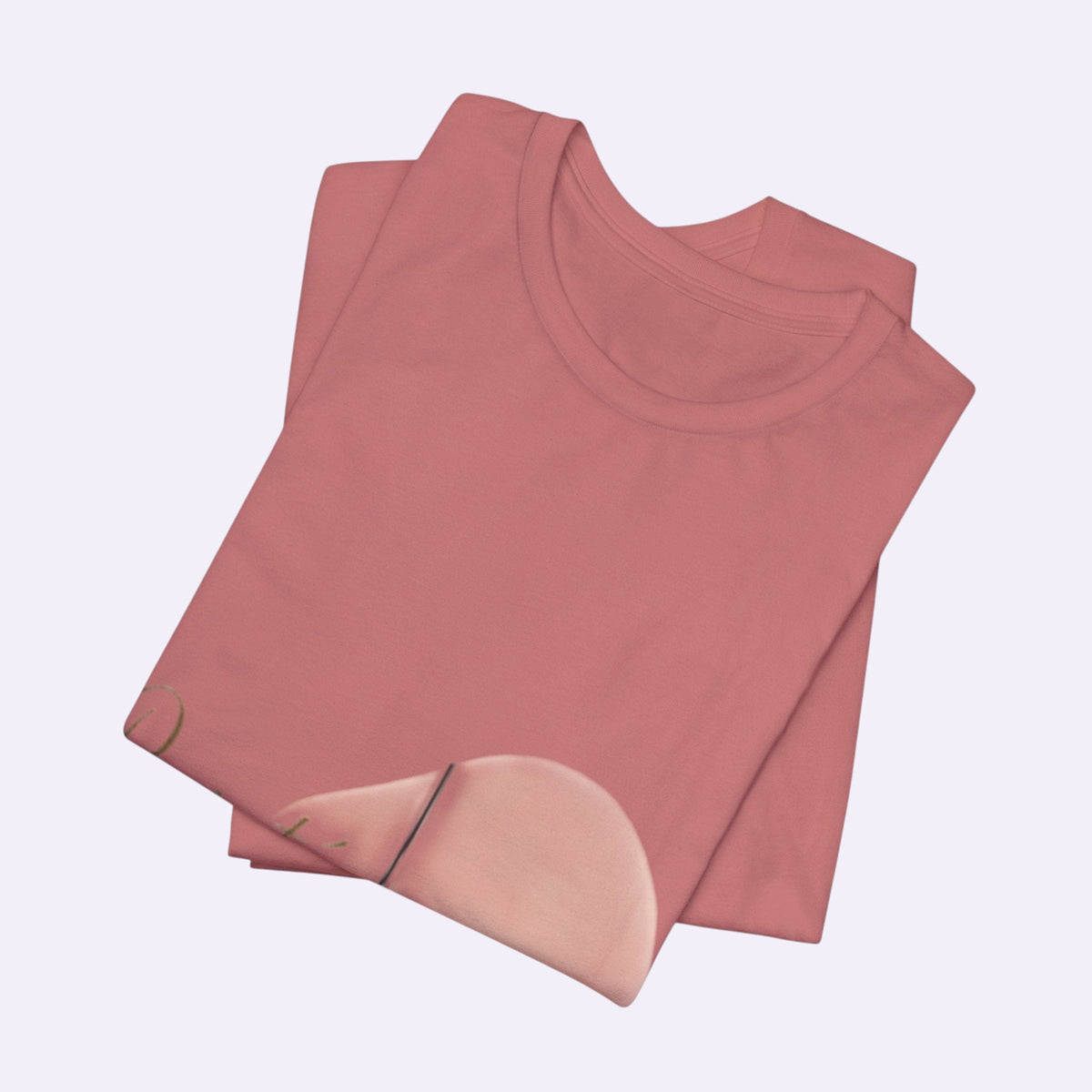 PURETE unisex jersey short sleeve tee in a soft dusty rose pink, folded neatly to show the crew neckline.