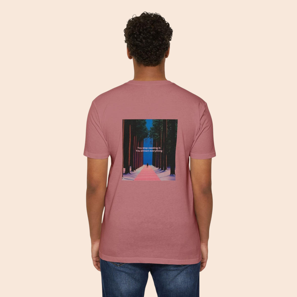 A model wearing a PURETE dusty pink cotton-blend t-shirt with a forest pathway graphic on the back.