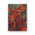 PURETE hardcover journal featuring a vibrant wraparound print of a woman in striped clothing with zebras and flowers.