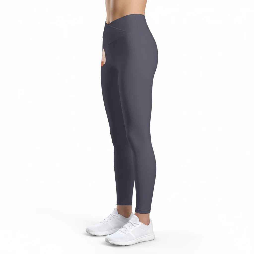 PURETE high-rise yoga leggings in dark grey with a cross-front waistband and floral heart graphic on the hip.