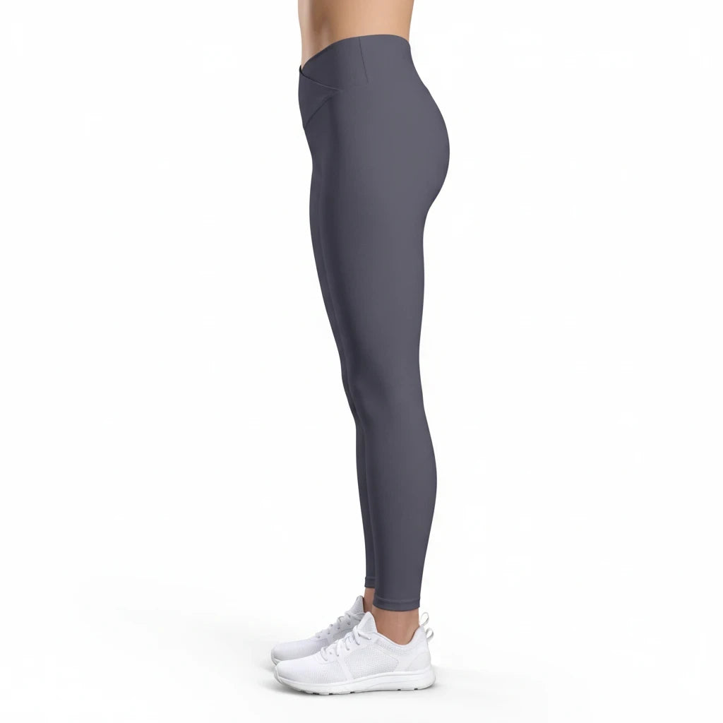 Side view of PURETE high-waist v-cut yoga leggings in dark grey, featuring a contoured waistband and stretchy fabric.