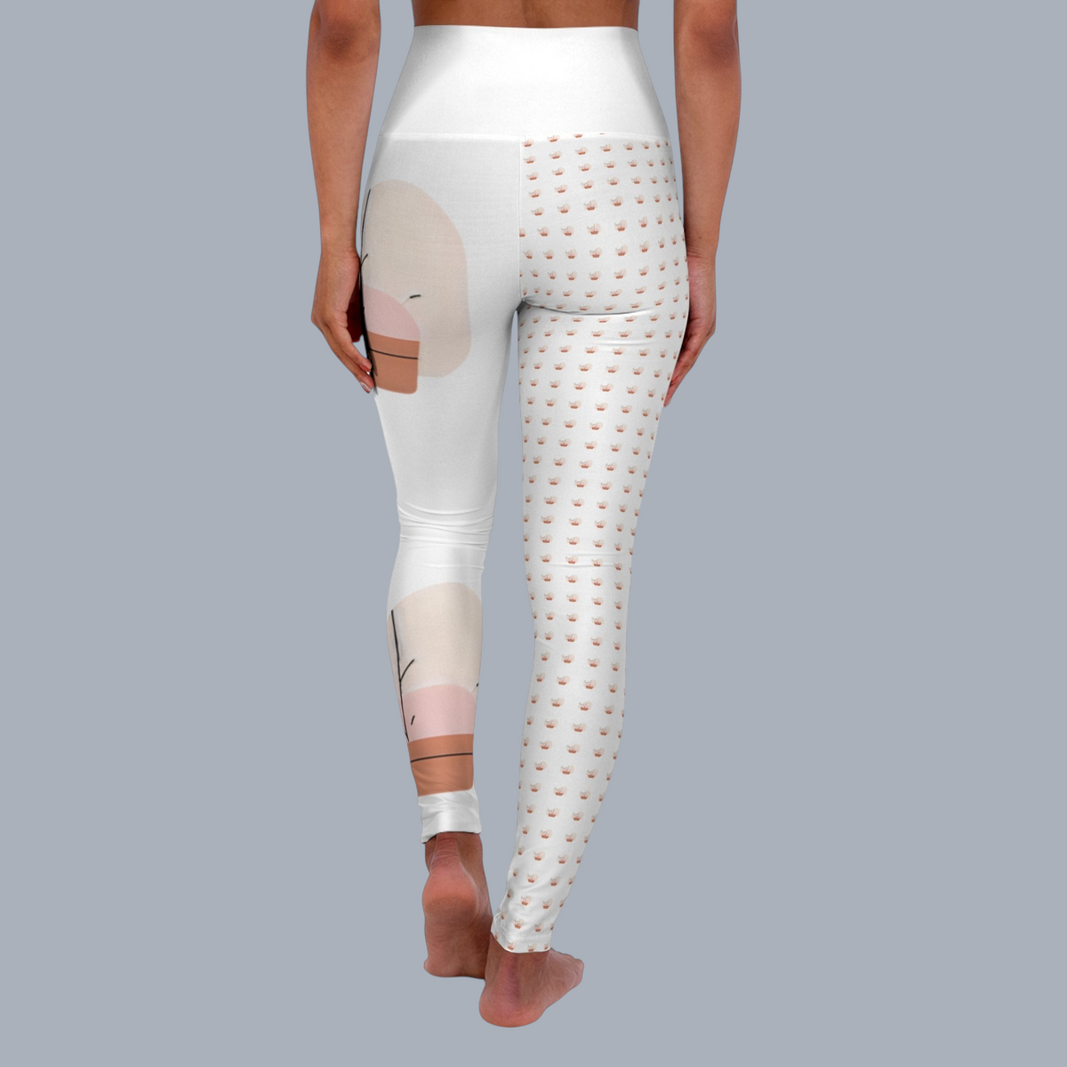 PURETE high-waisted yoga leggings with a split design featuring abstract shapes and a small crown pattern
