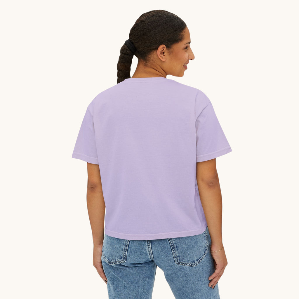 A woman wearing a PURETE lavender oversized boxy cotton t-shirt with a relaxed fit, viewed from the back.