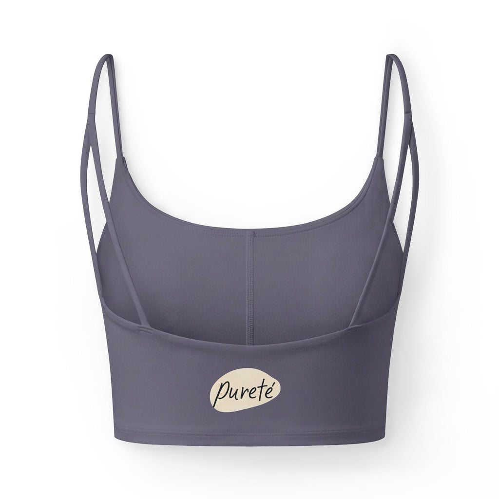 PURETE luxe crop sports bra in dark grey with slim double straps and a minimal plant pot graphic at the hem.