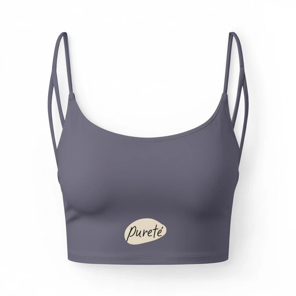 PURETE luxe crop sports bra in dark grey with double straps and a minimal plant pot graphic at the hem.