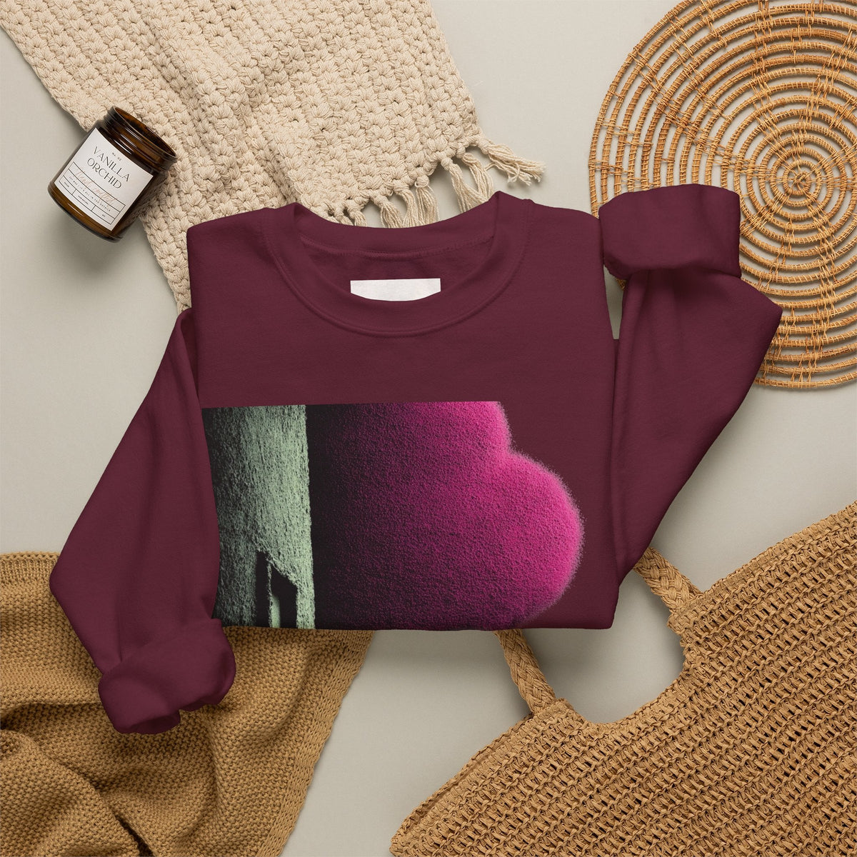 PURETE maroon crewneck sweatshirt with a vibrant pink and green graphic print, laid flat on a neutral background.