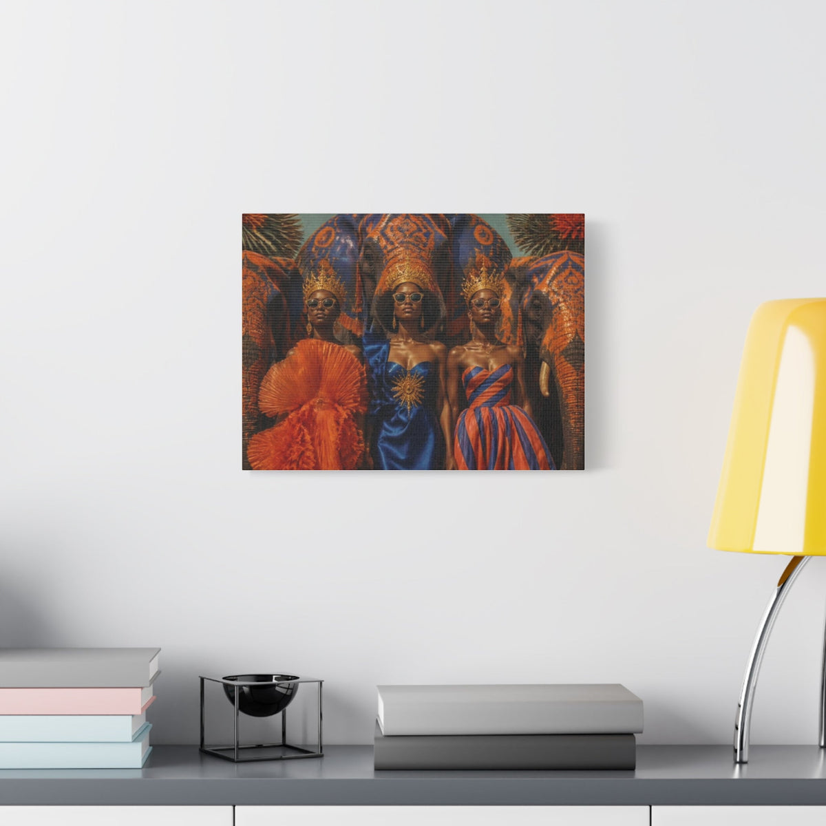 PURETE matte canvas print featuring three women in regal attire and elephant imagery hanging on a white wall.