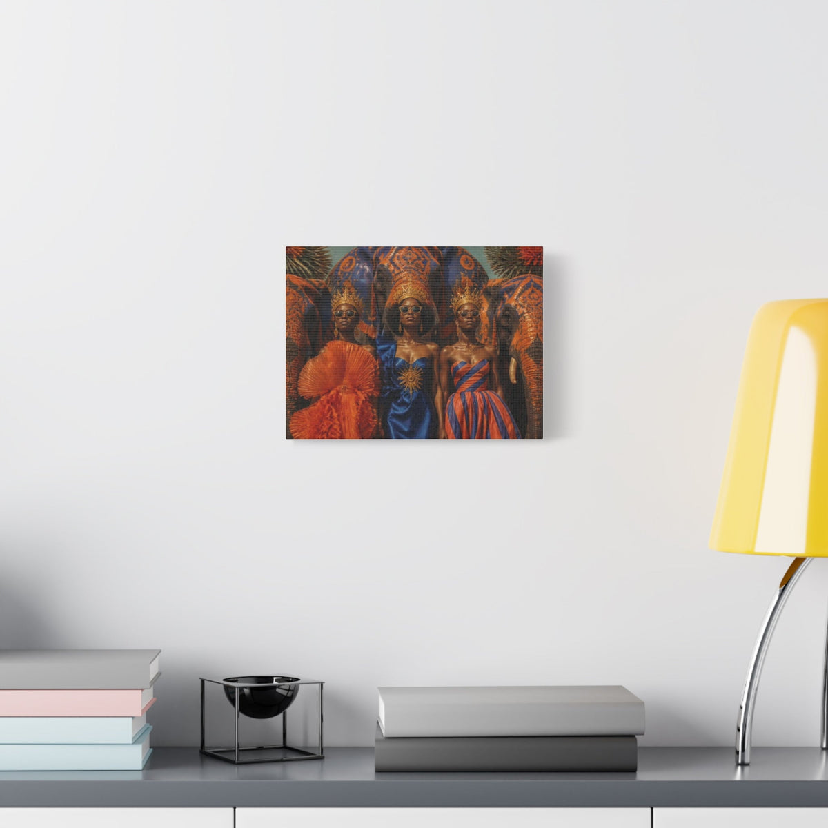 PURETE matte canvas wall art featuring three regal women in vibrant traditional attire hanging on a white wall.