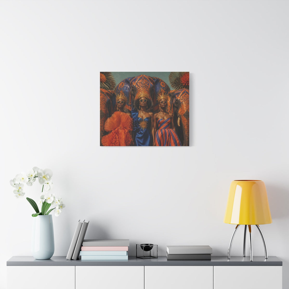 PURETE matte canvas print featuring three women in regal attire and elephant imagery hanging on a white wall.