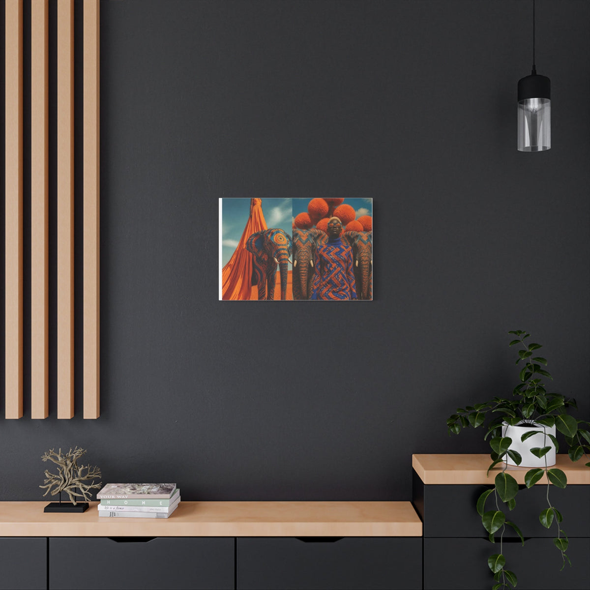 PURETE matte stretched canvas featuring vibrant elephant artwork hanging on a dark grey wall above a wooden console.