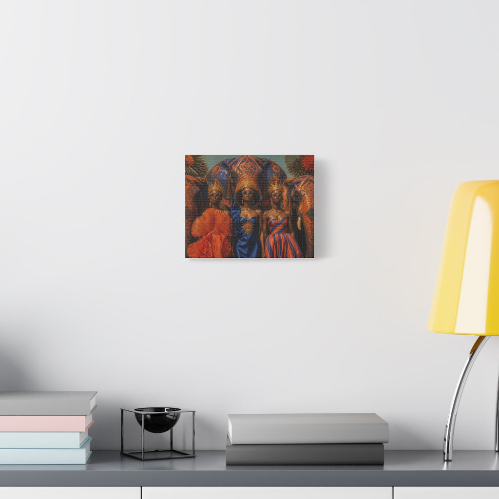 PURETE matte canvas featuring three women in ornate cultural attire hanging on a white wall above a desk with a lamp.