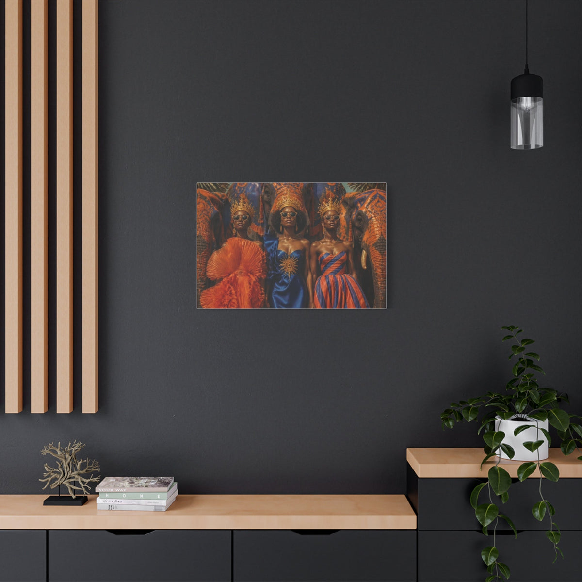 PURETE matte canvas print featuring a vibrant portrait of three women in crowns, displayed on a dark grey wall.