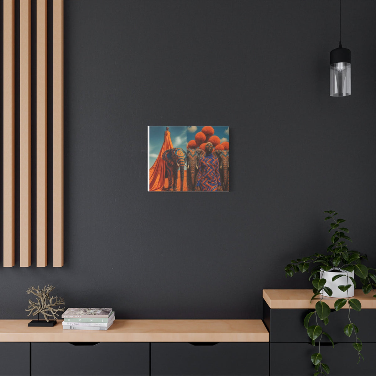 PURETE matte canvas art featuring an elephant and person print hanging on a dark grey wall above a wooden console.