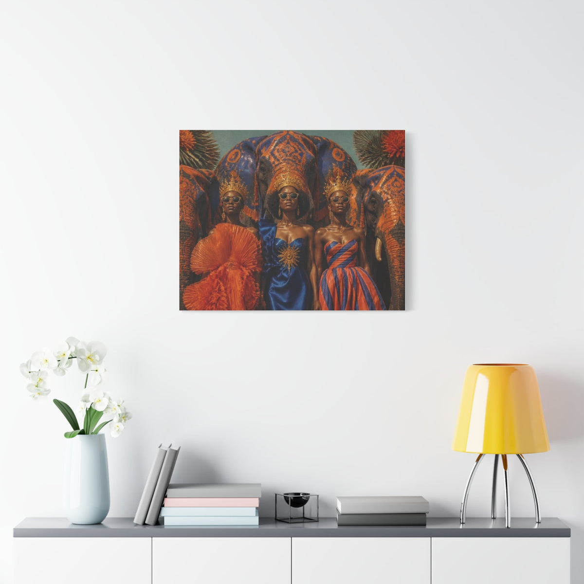 PURETE matte canvas wall art featuring three women in regal attire and elephant imagery hanging above a modern console.