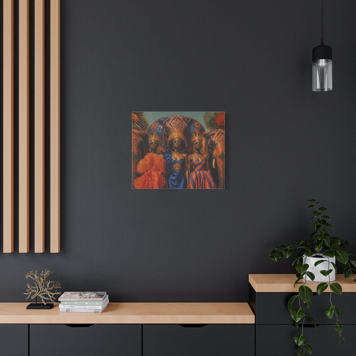 PURETE matte canvas wall art featuring three women in ornate crowns and vibrant dresses against a dark grey wall.