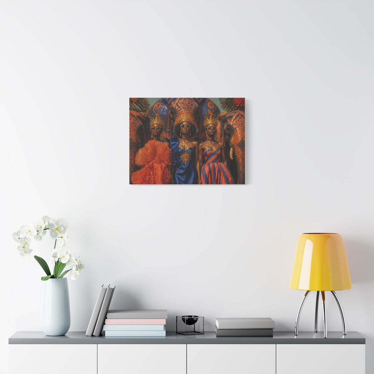 PURETE matte canvas print featuring three women in regal attire and elephant imagery hanging on a white wall.