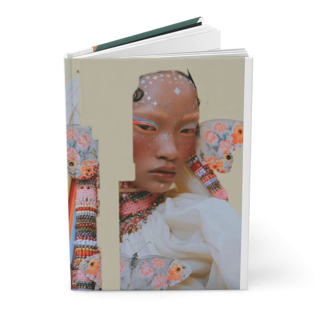 PURETE hardcover journal featuring a vibrant artistic portrait of a person with butterfly wings and star embellishments