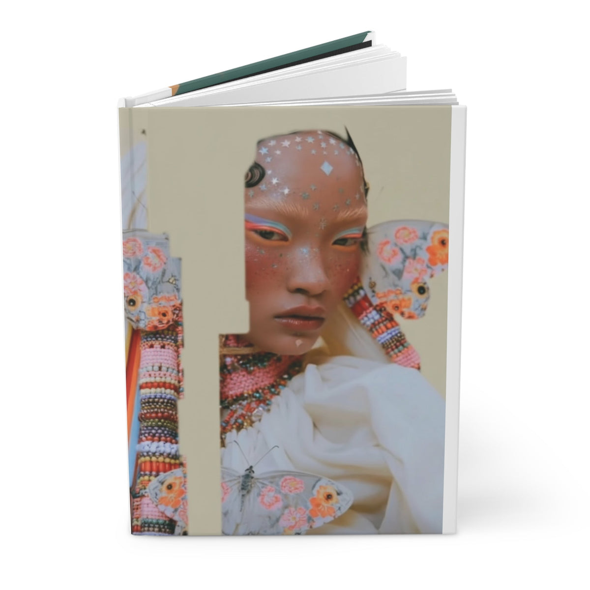 PURETE hardcover journal featuring a vibrant artistic portrait of a person with butterfly wings and star embellishments