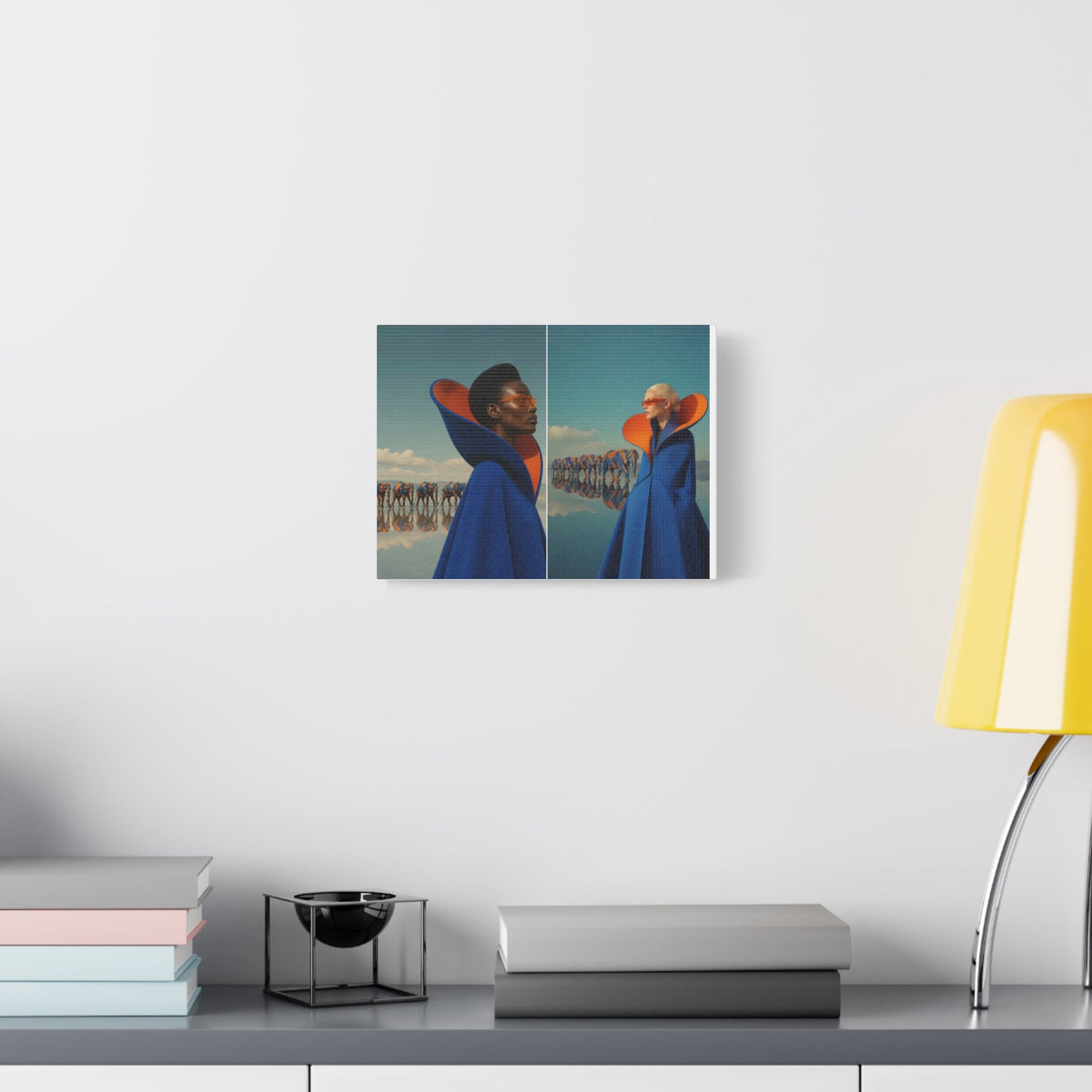 PURETE matte canvas print featuring a fashion photography diptych displayed on a white wall above a desk with a lamp.