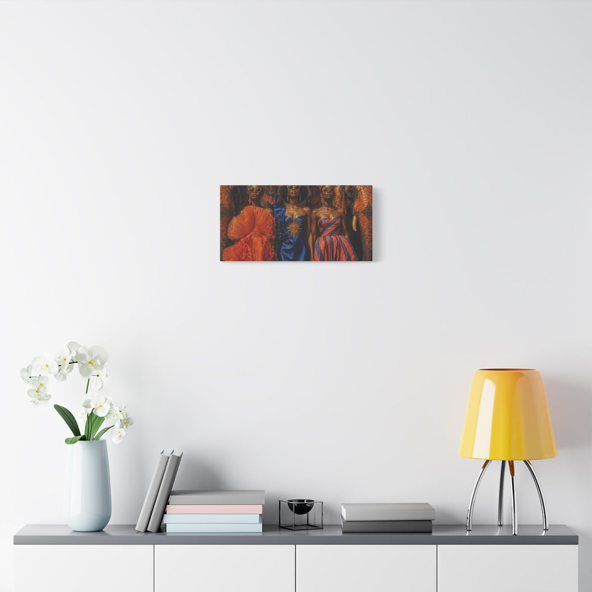 PURETE matte canvas print featuring three women in vibrant fashion displayed on a white wall above a modern sideboard.