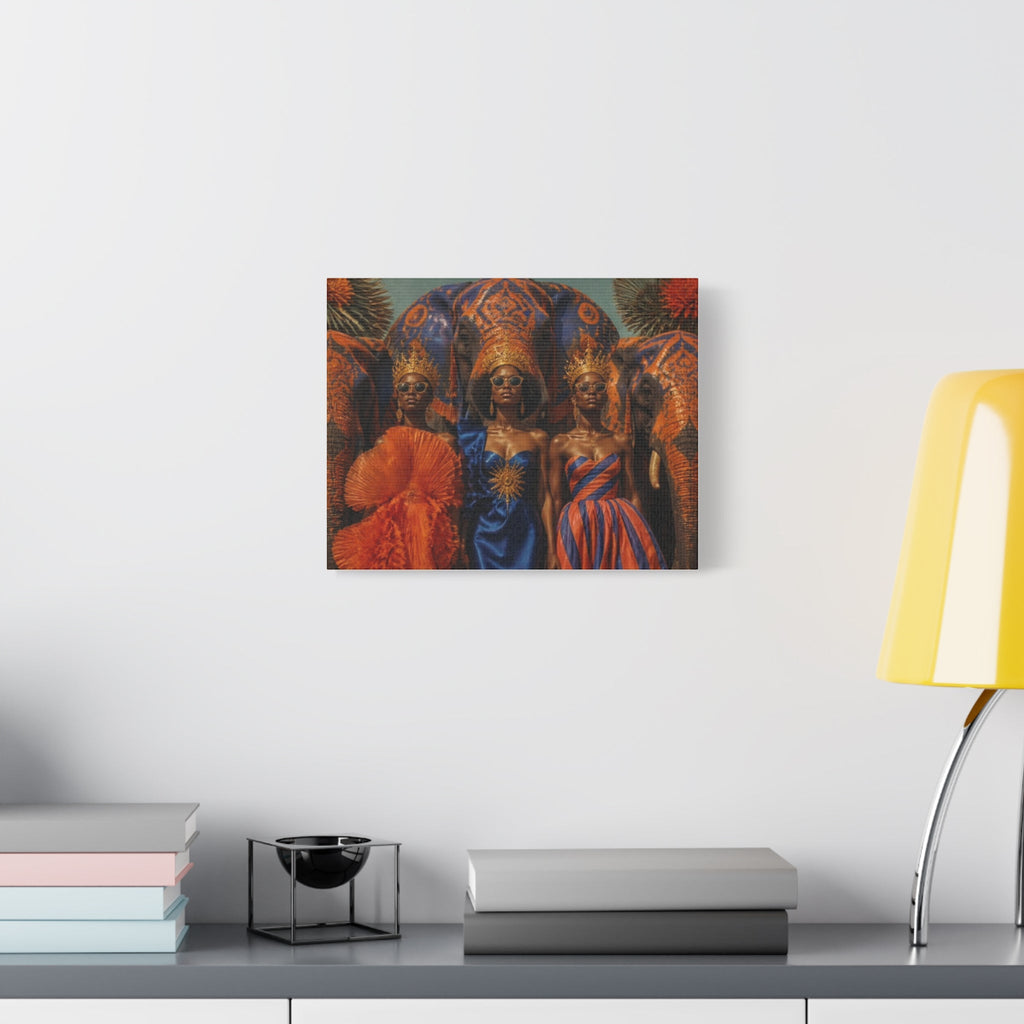 PURETE matte stretched canvas featuring three women in ornate gowns and crowns with an elephant, hanging on a wall.