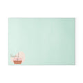 PURETE tempered glass cutting board in light mint green with a minimalist potted plant logo in the corner