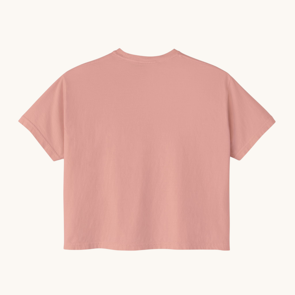 Back view of a PURETE women's oversized boxy t-shirt in a soft dusty pink pigment-dyed cotton fabric.