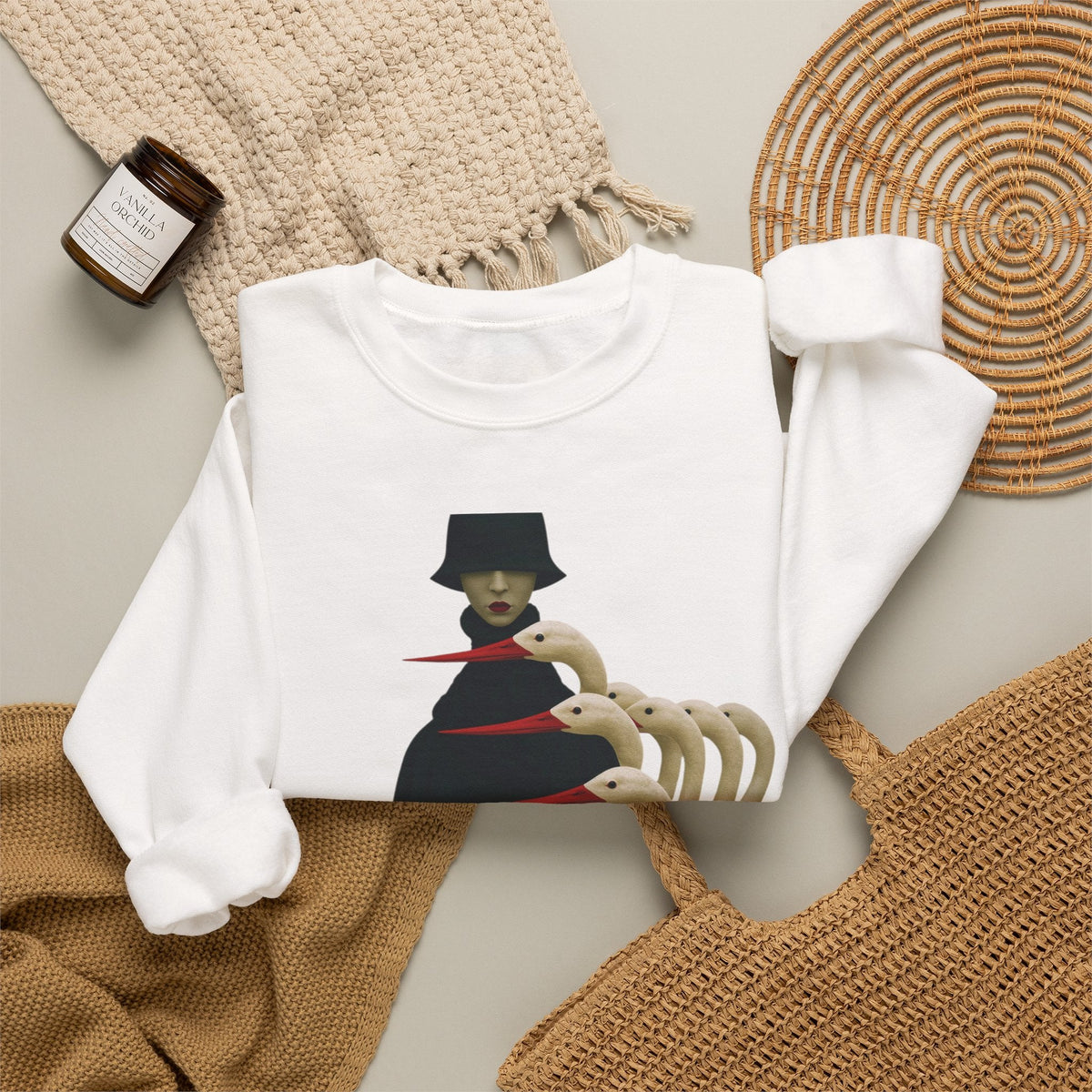PURETE white crewneck sweatshirt featuring a surreal graphic of a cloaked figure with bird-like heads on a neutral background
