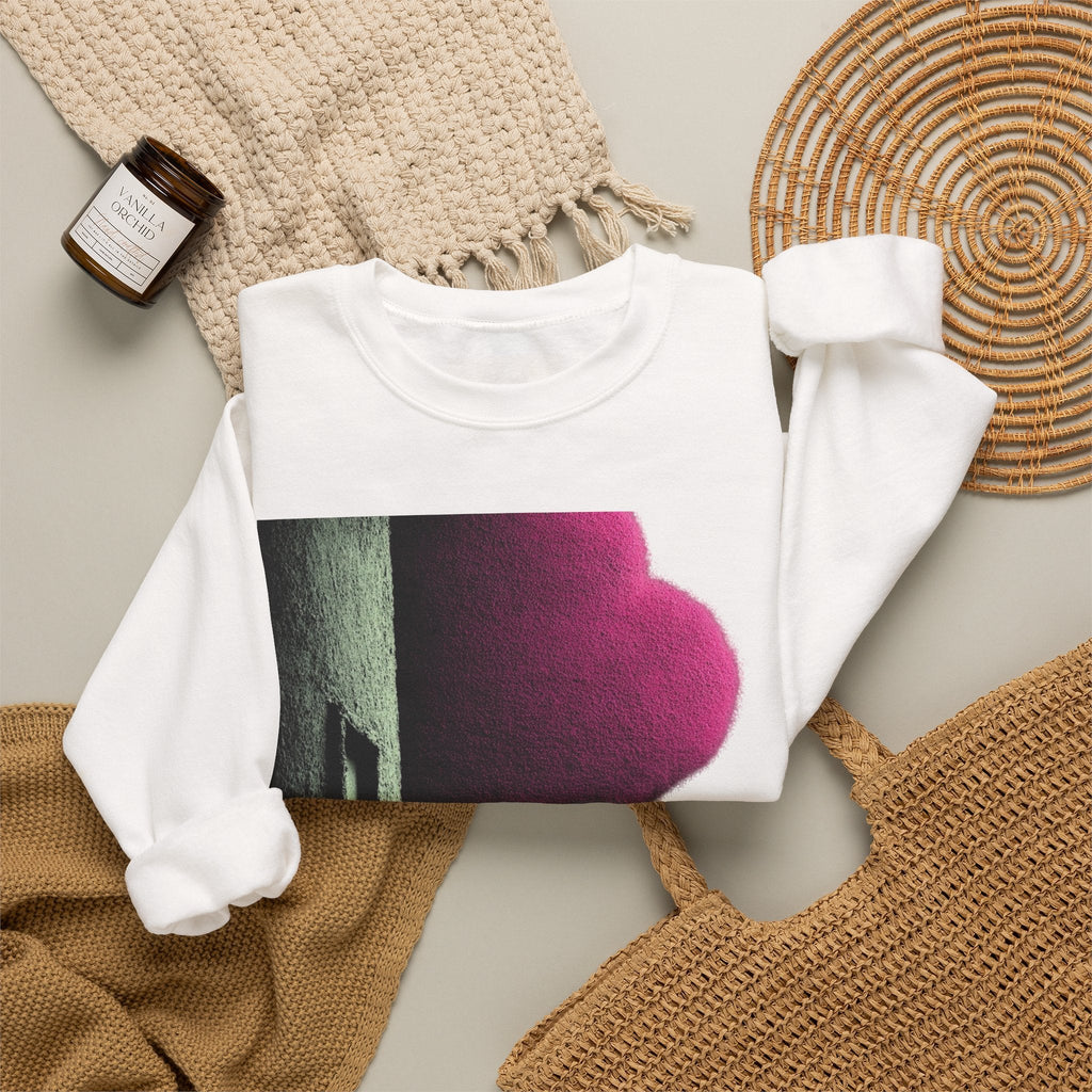 PURETE white crewneck sweatshirt with a bold magenta and black graphic print, styled on a neutral background.