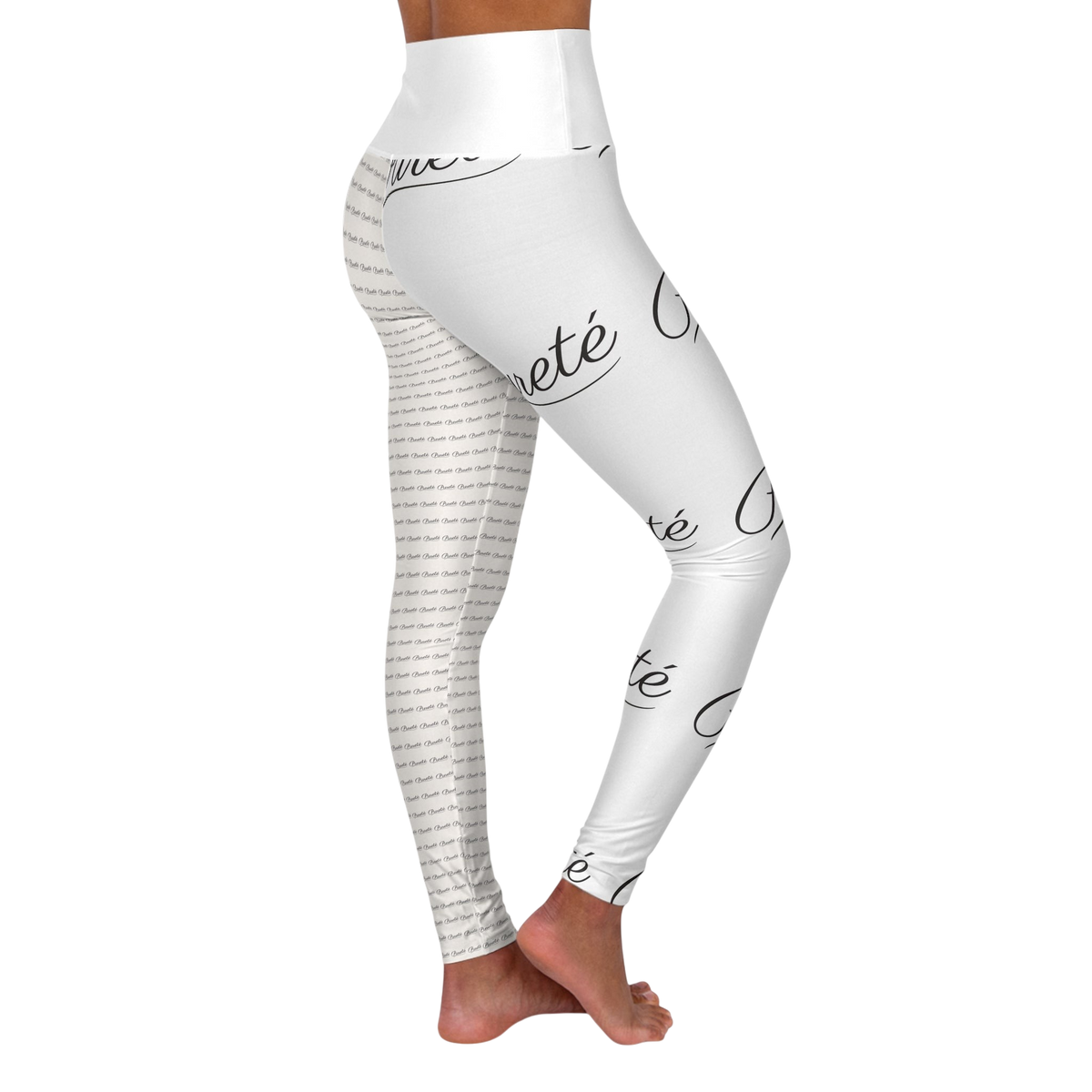 PURETE high-waisted yoga leggings in white with a black all-over script logo print, shown from a side profile view.