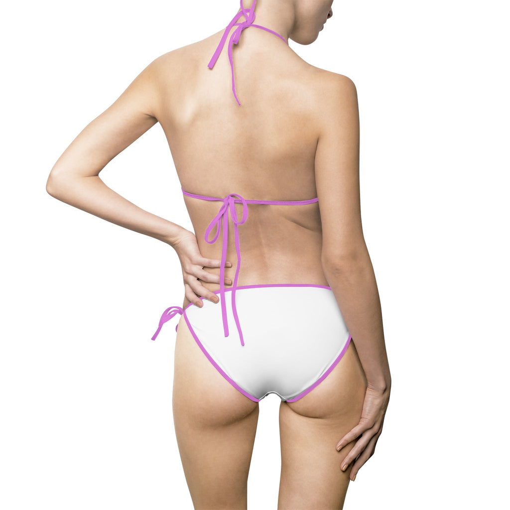Back view of a woman wearing a white bikini with pink trim from PURETE, featuring elastic tie straps.