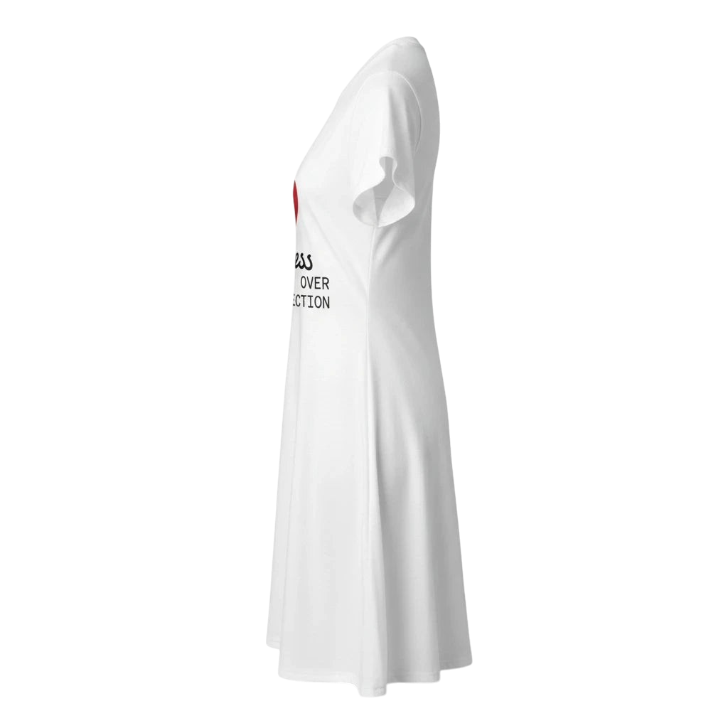 PURETE white polyester t-shirt dress with all-over print, side view showing tagless design and flared silhouette.