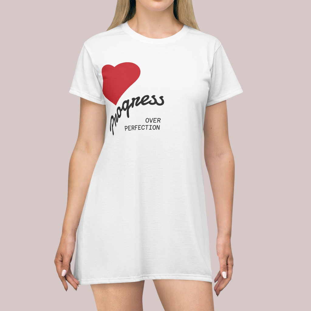 PURETE white polyester t-shirt dress featuring a red heart and Progress Over Perfection text print on a model