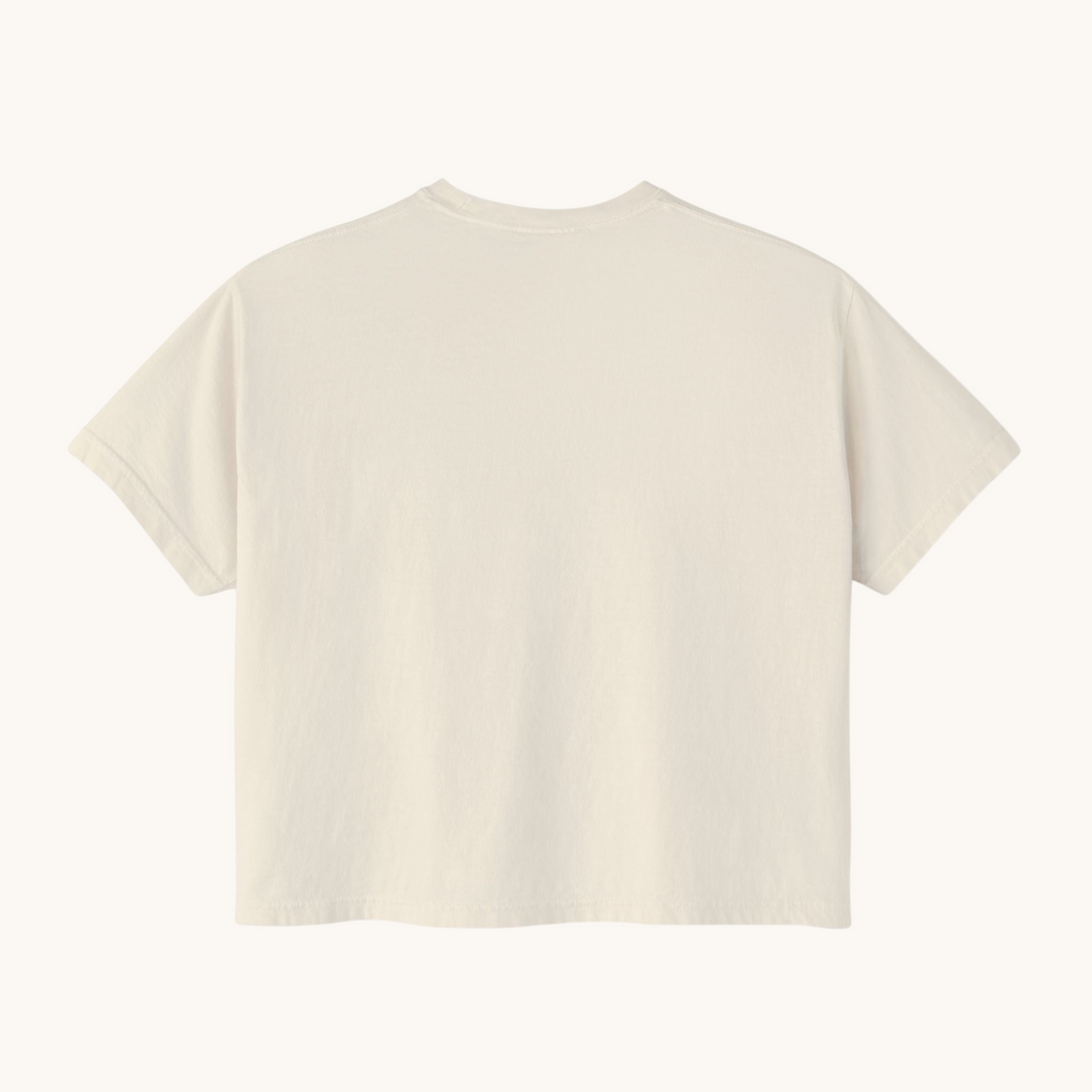 Back view of a PURETE women's oversized boxy t-shirt in a neutral cream pigment-dyed cotton fabric.