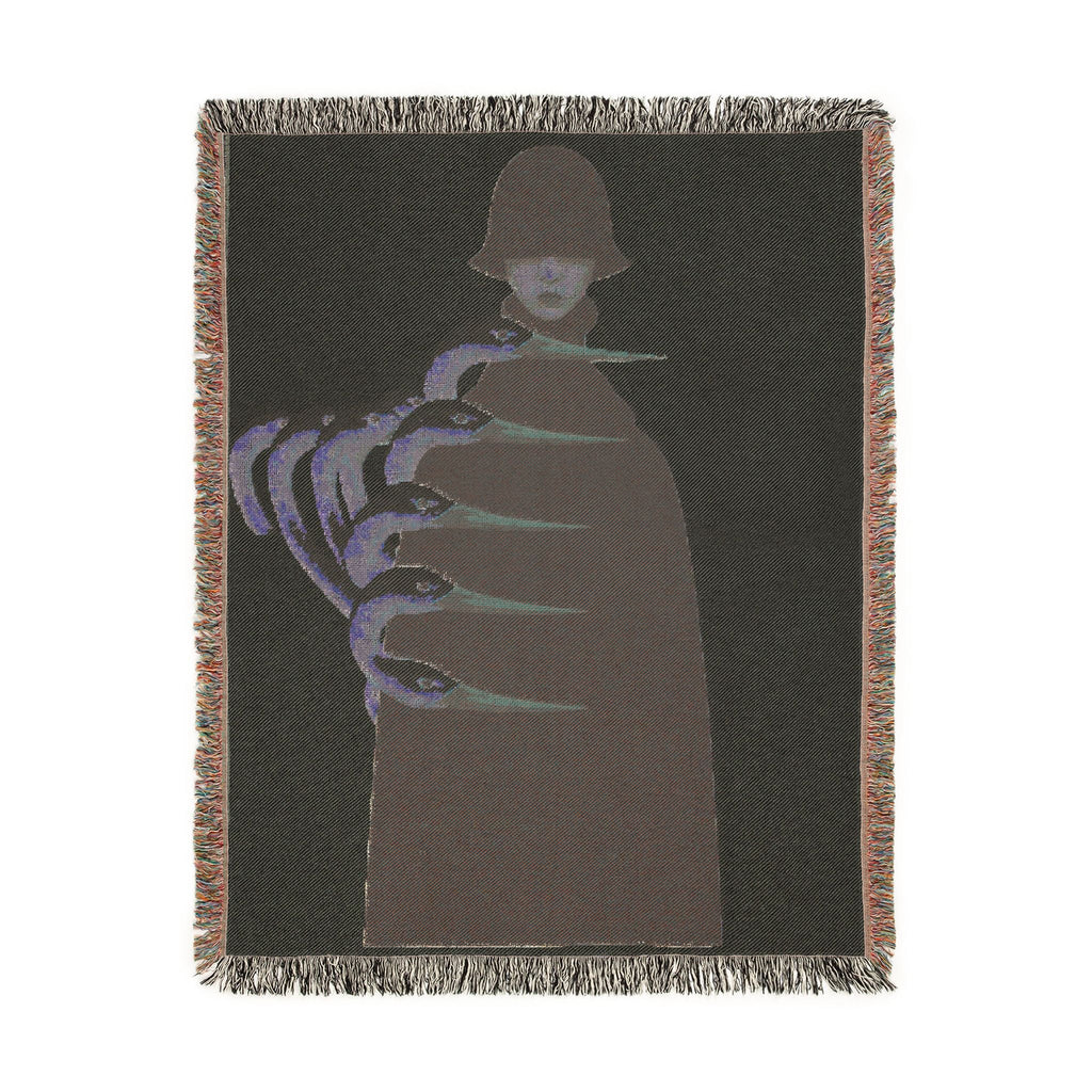 PURETE woven cotton throw blanket featuring a dark artistic illustration of a figure with elongated claw-like hands.